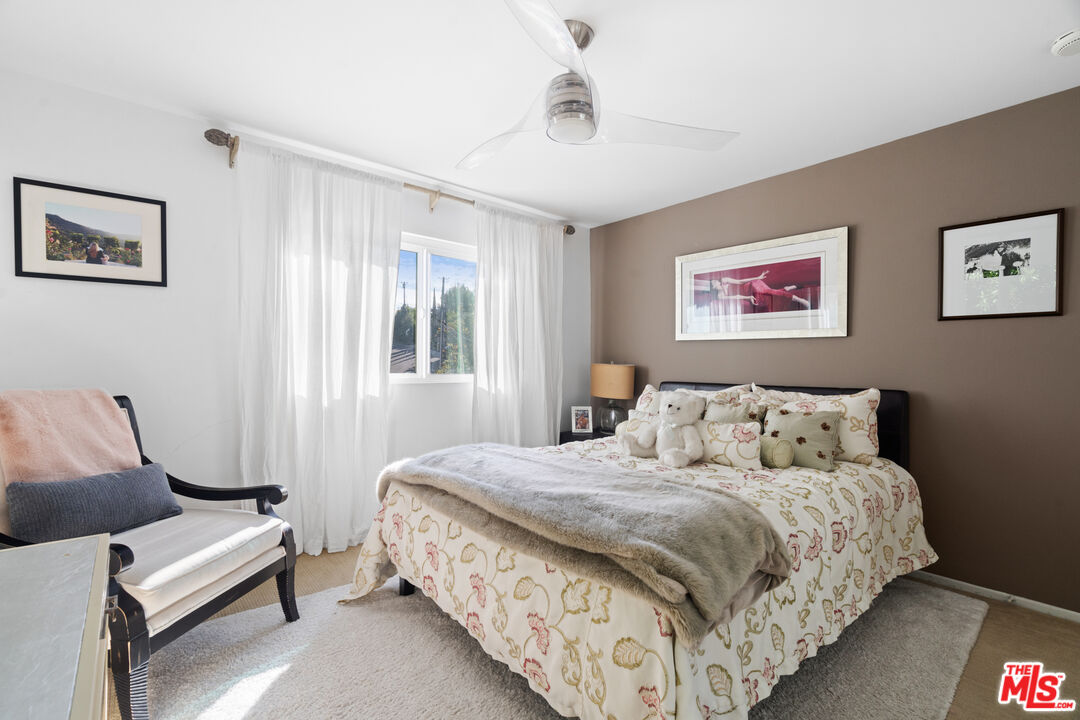 9767 Apricot Lane Beverly Hills, CA 90210 - Photo 20 of 29 a bedroom with bed and a window