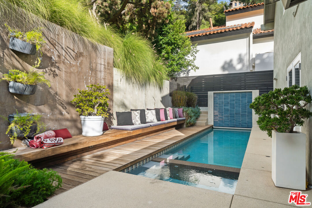 9767 Apricot Lane Beverly Hills, CA 90210 - Photo 24 of 29 a view of a house with backyard and sitting area