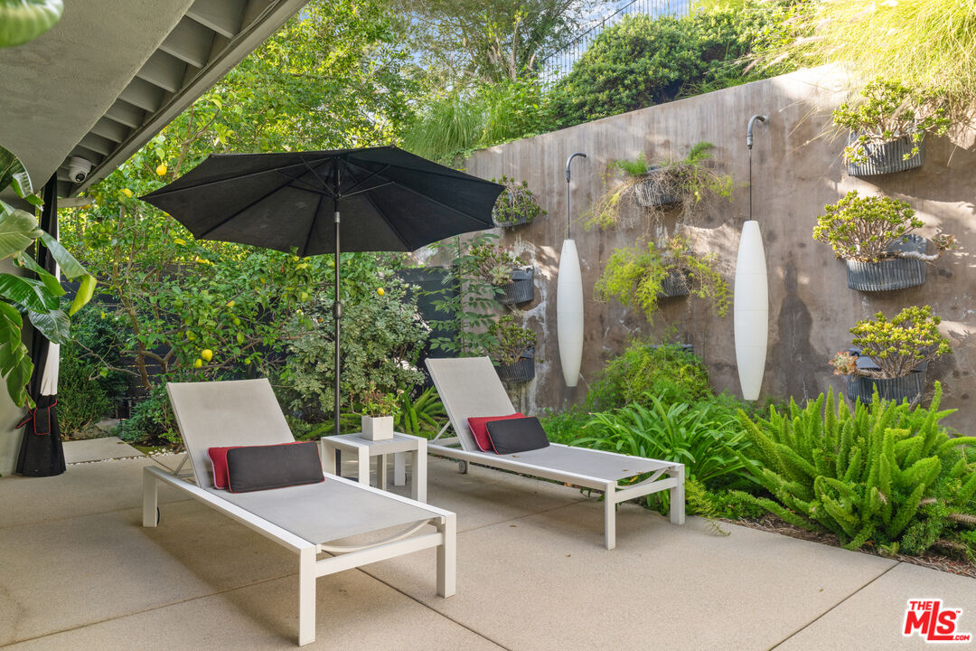 9767 Apricot Lane Beverly Hills, CA 90210 - Photo 26 of 29 a view of backyard with outdoor seating and trees