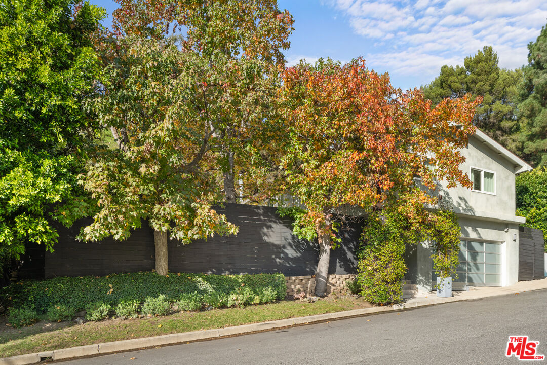 9767 Apricot Lane Beverly Hills, CA 90210 - Photo 3 of 29 a view of a house with a tree