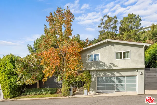 a view of a house with a tree