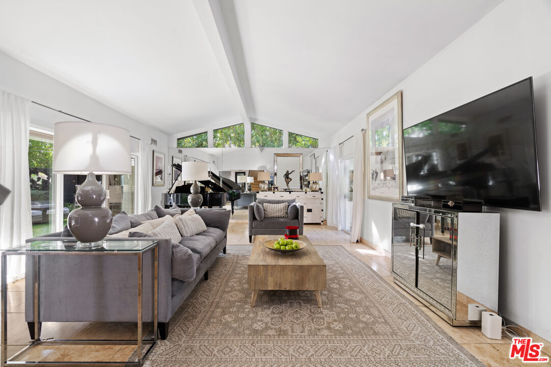 9767 Apricot Lane Beverly Hills, CA 90210 - Photo 9 of 29 a living room with furniture and a flat screen tv