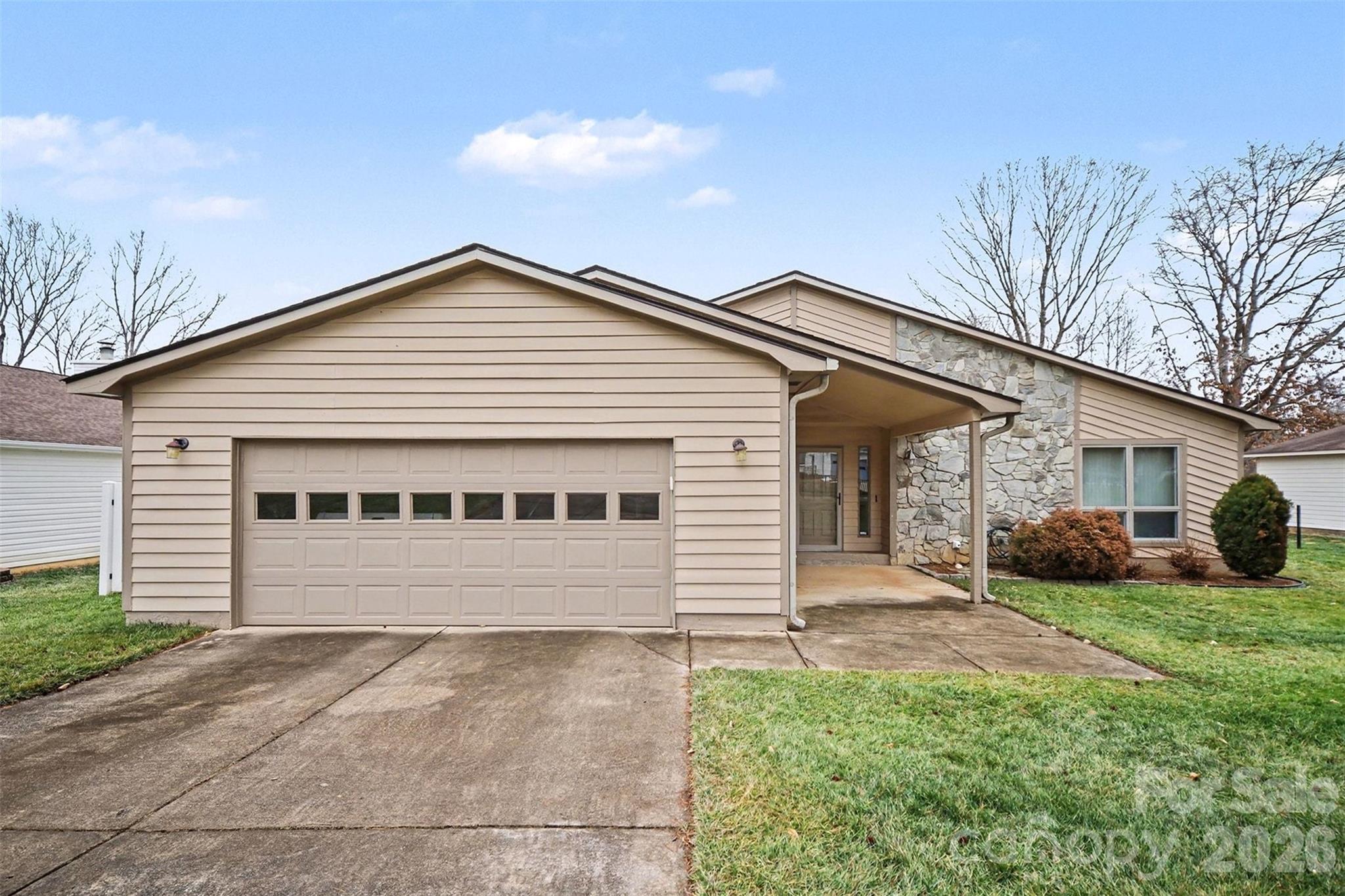 a view of a house with a yard