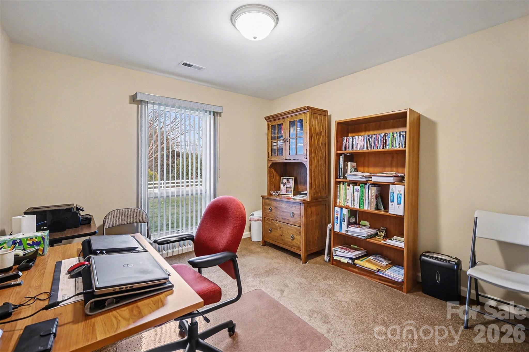 9325 Chislehurst Road Mint Hill, NC 28227 - Photo 17 of 30 a view of a workspace with furniture and a window