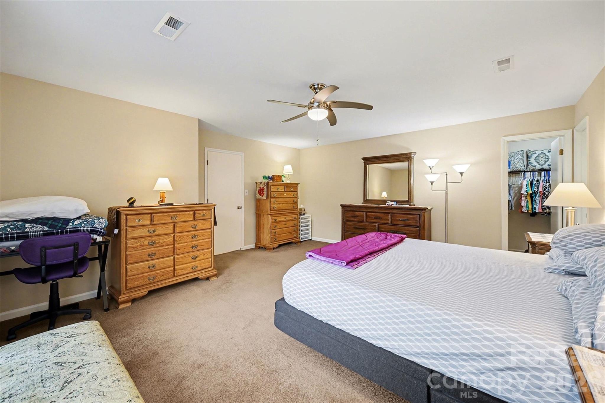 9325 Chislehurst Road Mint Hill, NC 28227 - Photo 20 of 30 a bedroom with a bed and dresser