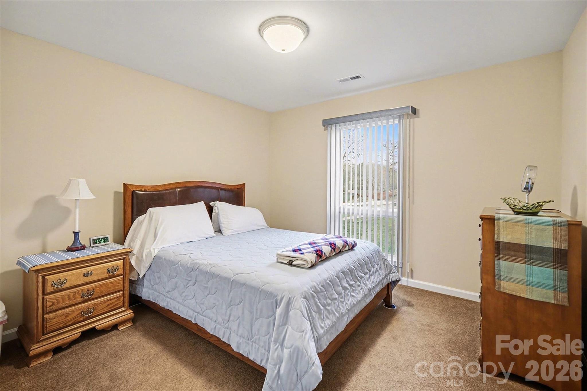 9325 Chislehurst Road Mint Hill, NC 28227 - Photo 22 of 30 a bedroom with a bed and a window