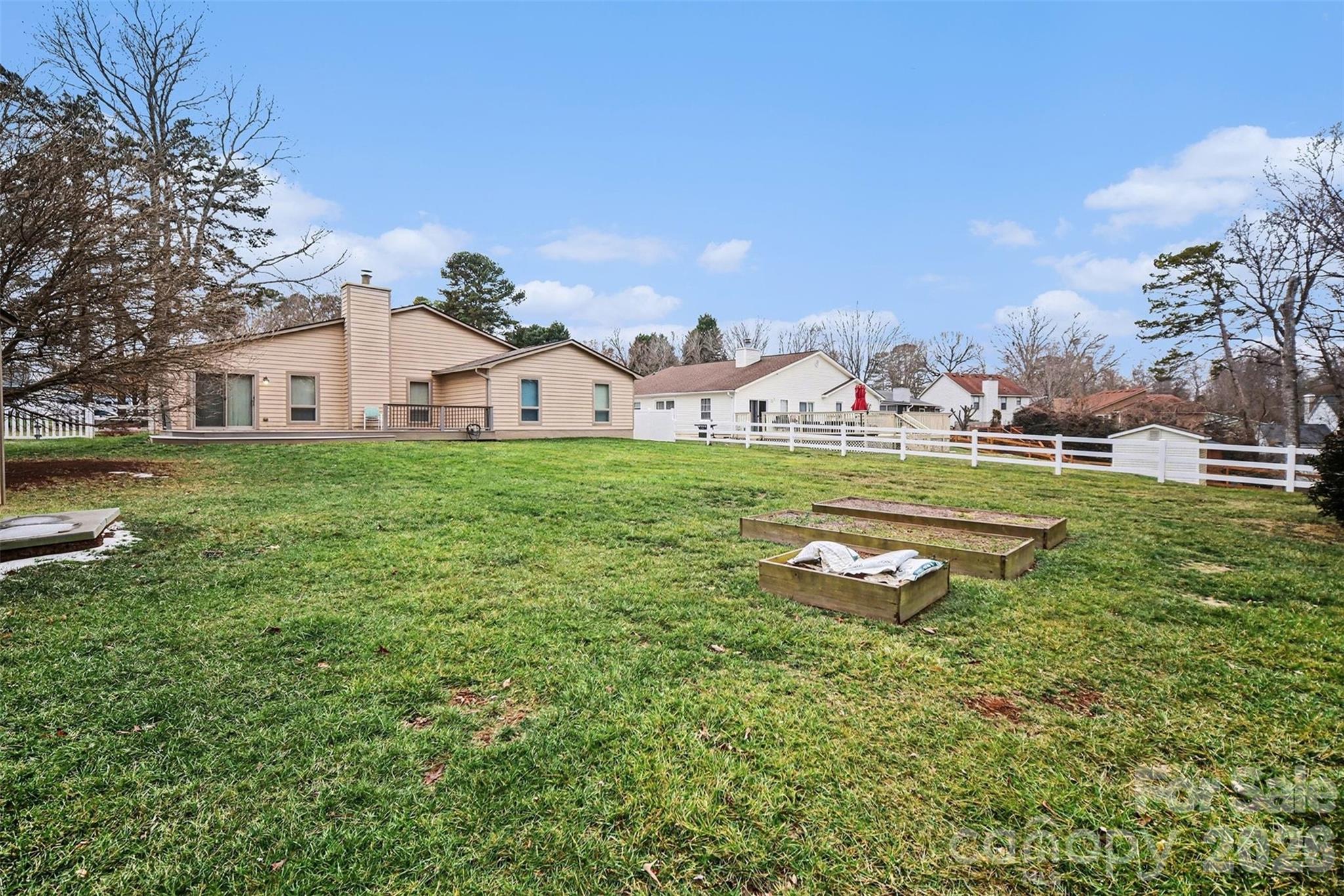 9325 Chislehurst Road Mint Hill, NC 28227 - Photo 28 of 30 a view of a house with a big yard and large trees