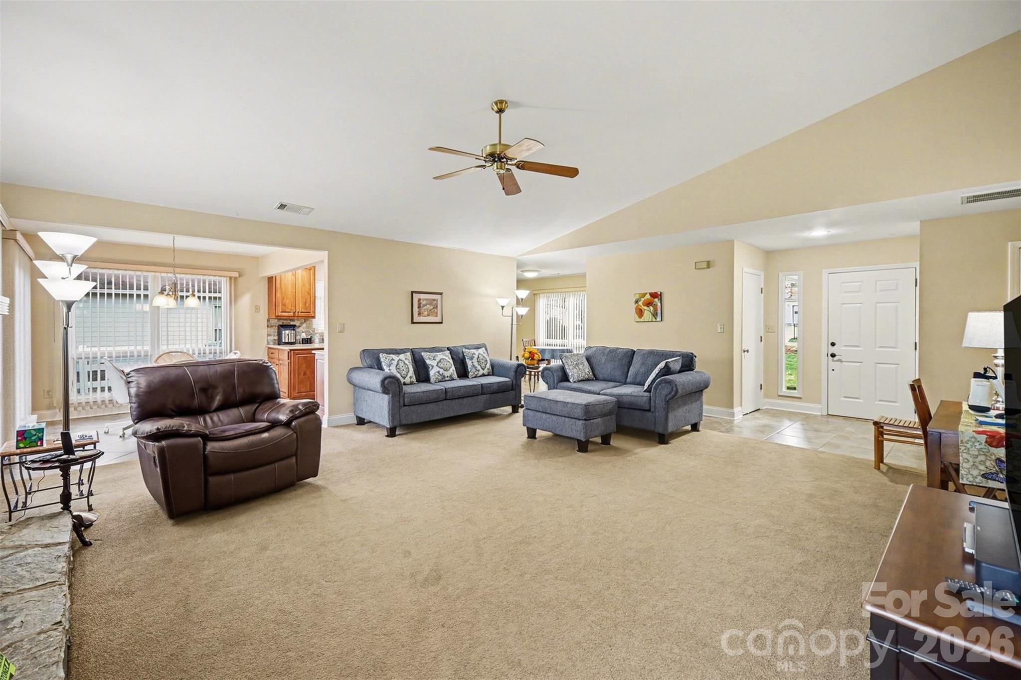 9325 Chislehurst Road Mint Hill, NC 28227 - Photo 7 of 30 a living room with furniture and a chandelier