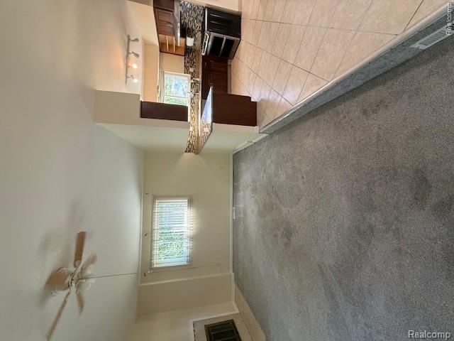 43038 Hanford Road Canton, MI 48187 - Photo 21 of 36 Open concept living area featuring a fireplace, ceiling fan, and carpeted flooring