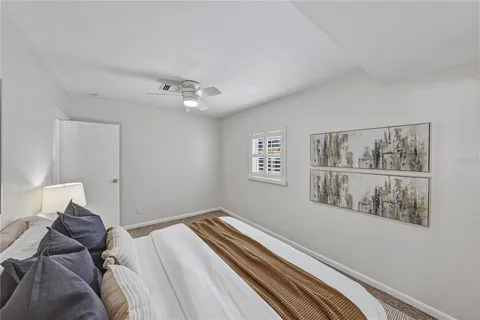 a bathroom with a toilet a sink and a window