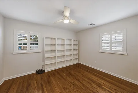 a view of empty room with windows