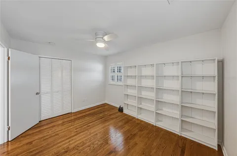 an empty room with sliding glass door and mountain view