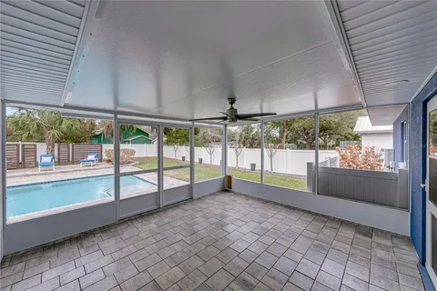 swimming pool view with a seating space