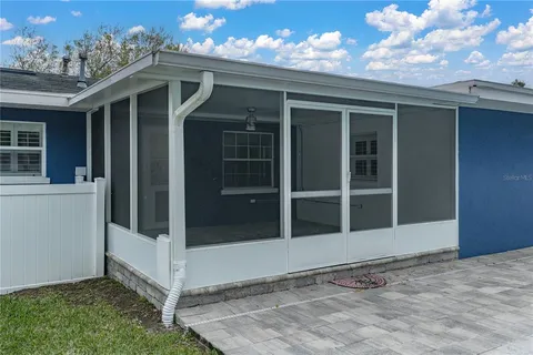 a view of chairs and tables in the patio