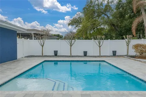an aerial view of a garden with mountain