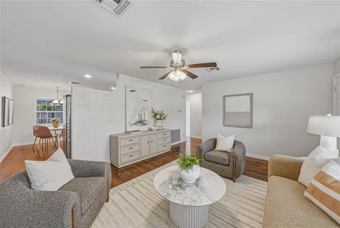 a spacious bathroom with a double vanity sink and a mirror