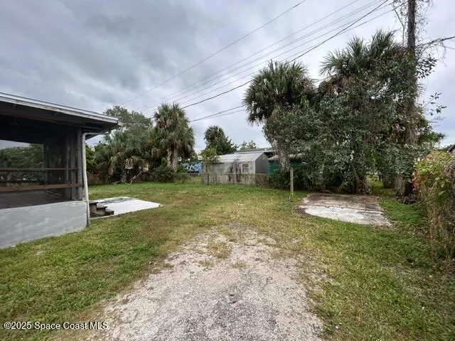 a view of a backyard with a garden