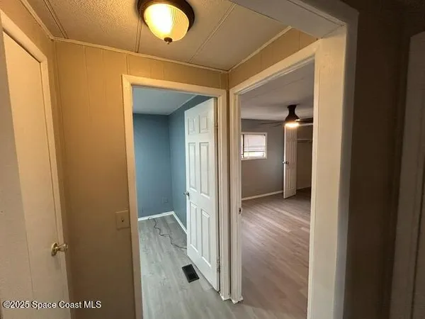 a view of a bathroom from a hallway