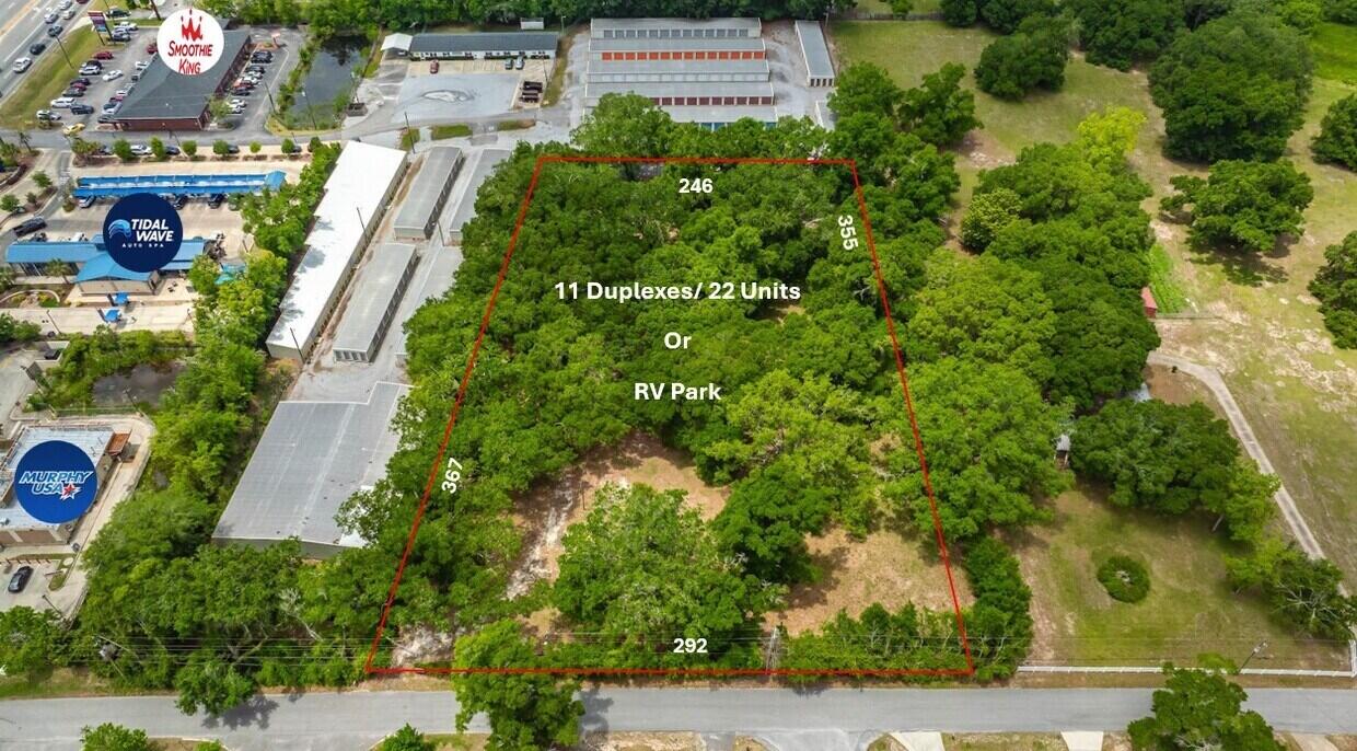 4643 Keyser Lane Pace, FL 32571 - Photo 13 of 14 an aerial view of residential houses with outdoor space and trees