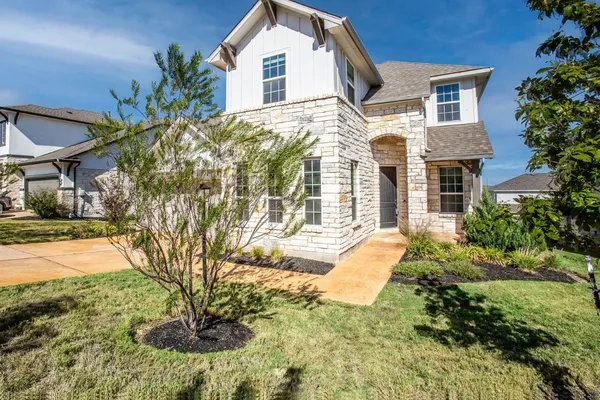 a house view with a garden space