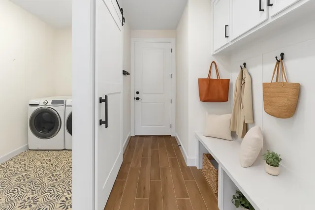 a hallway with a washer and dryer