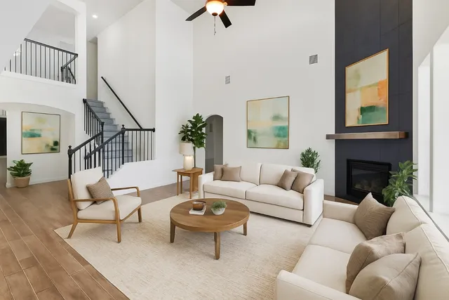 a living room with furniture and a fireplace