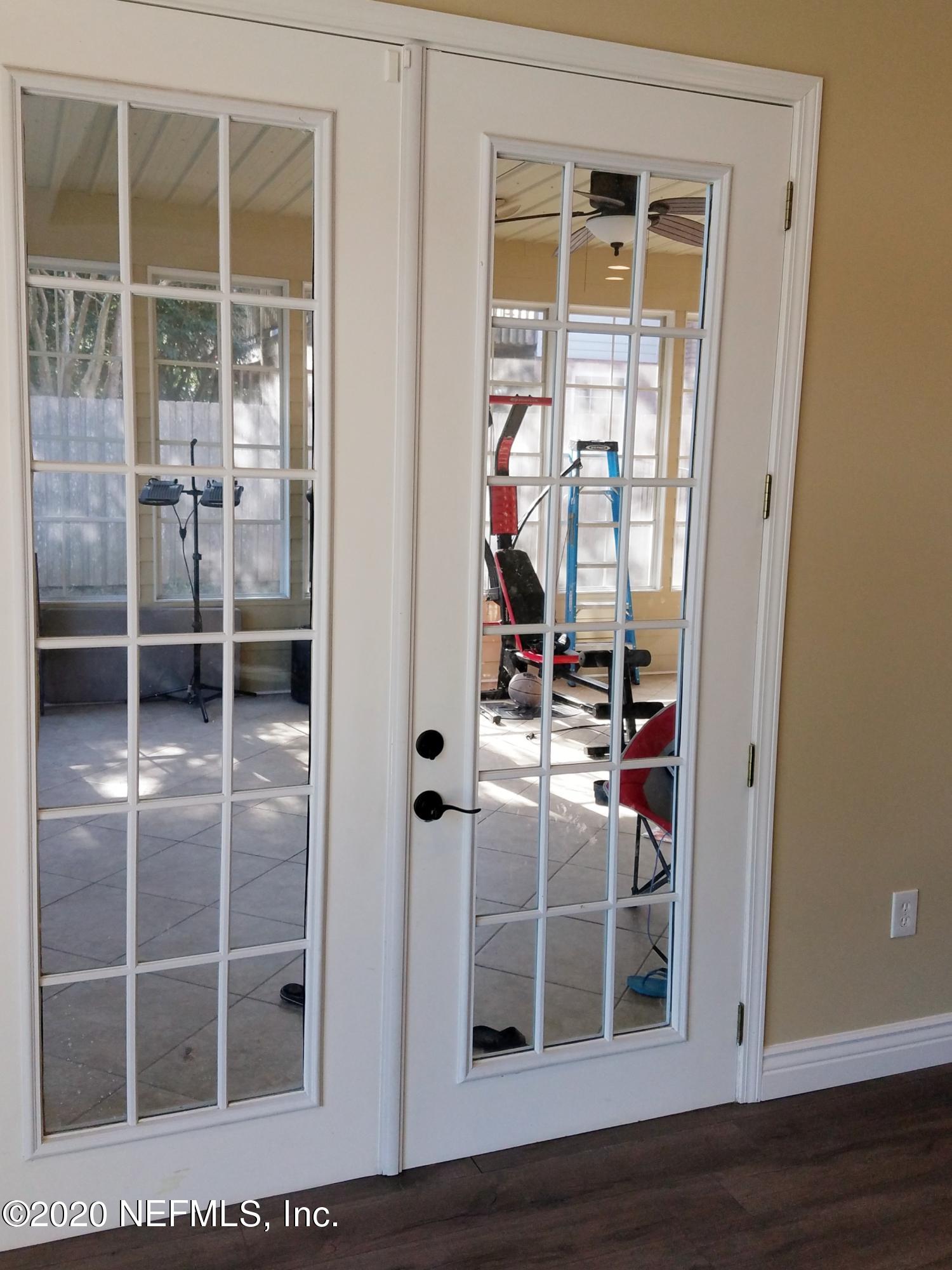1501 Cedar Bay Road Jacksonville, FL 32218 - Photo 13 of 49 a view of a hardwood & floor to ceiling window