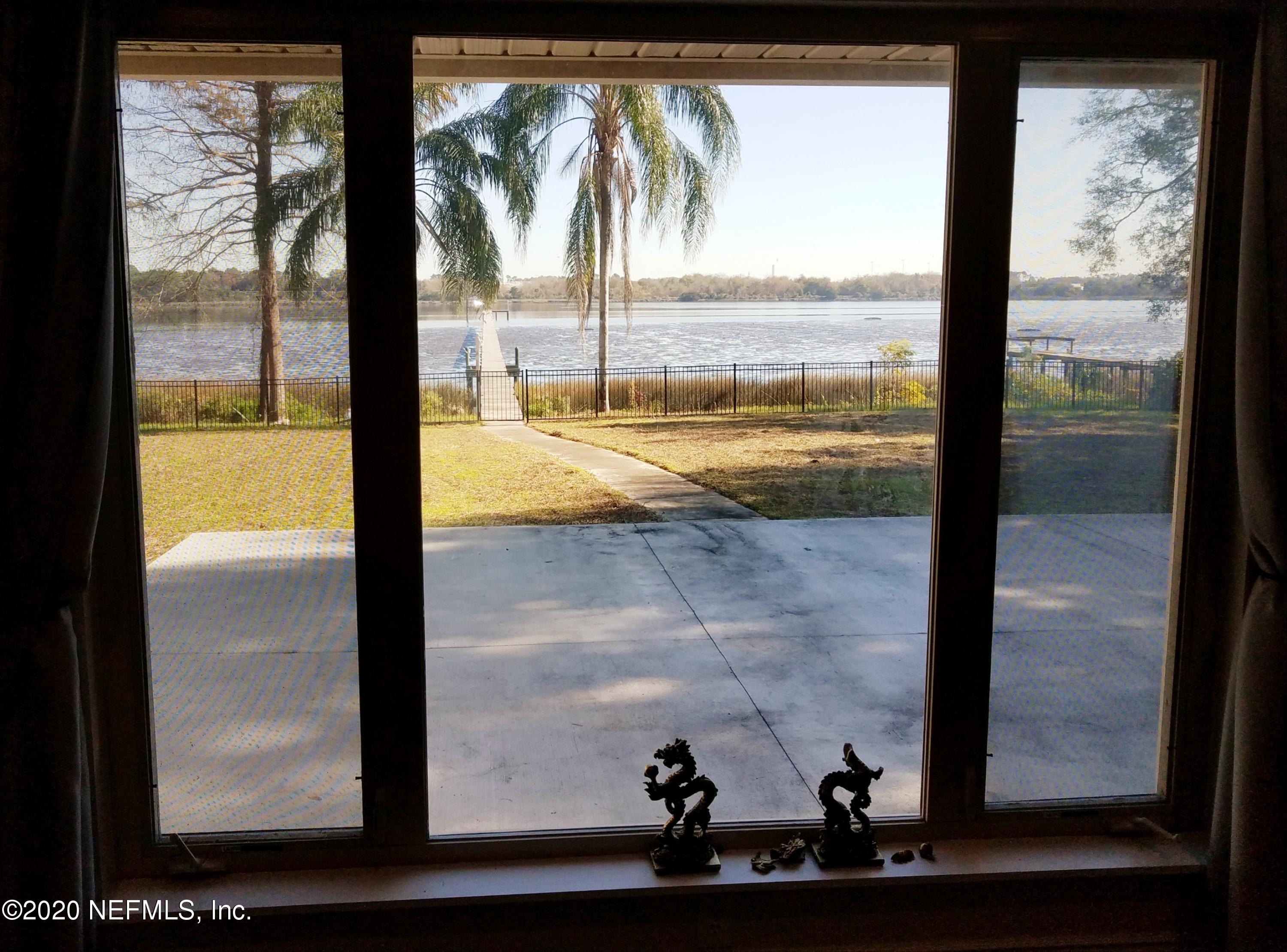 1501 Cedar Bay Road Jacksonville, FL 32218 - Photo 24 of 49 a view of a glass door and porch