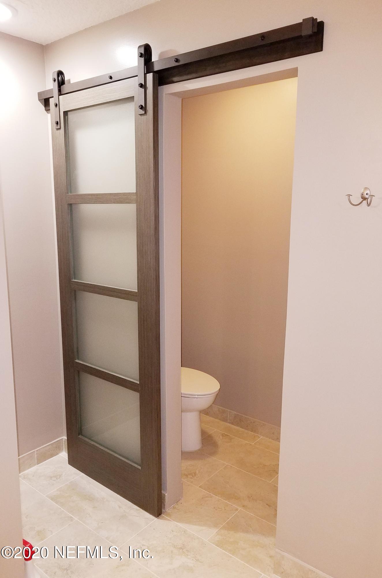 1501 Cedar Bay Road Jacksonville, FL 32218 - Photo 31 of 49 a bathroom with a toilet and a shower