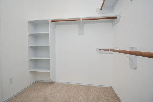 a view of an empty walk in closet