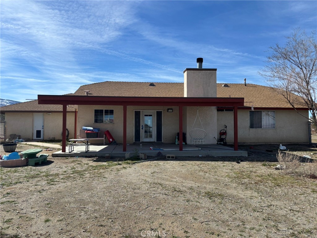 9591 Colfax Road Phelan, CA 92371 - Photo 17 of 24 a front view of a house with garden