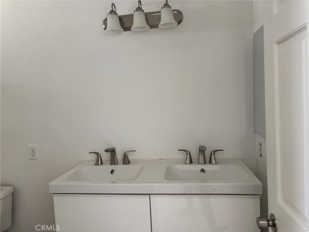 9591 Colfax Road Phelan, CA 92371 - Photo 2 of 24 a bathroom with a sink and a toilet
