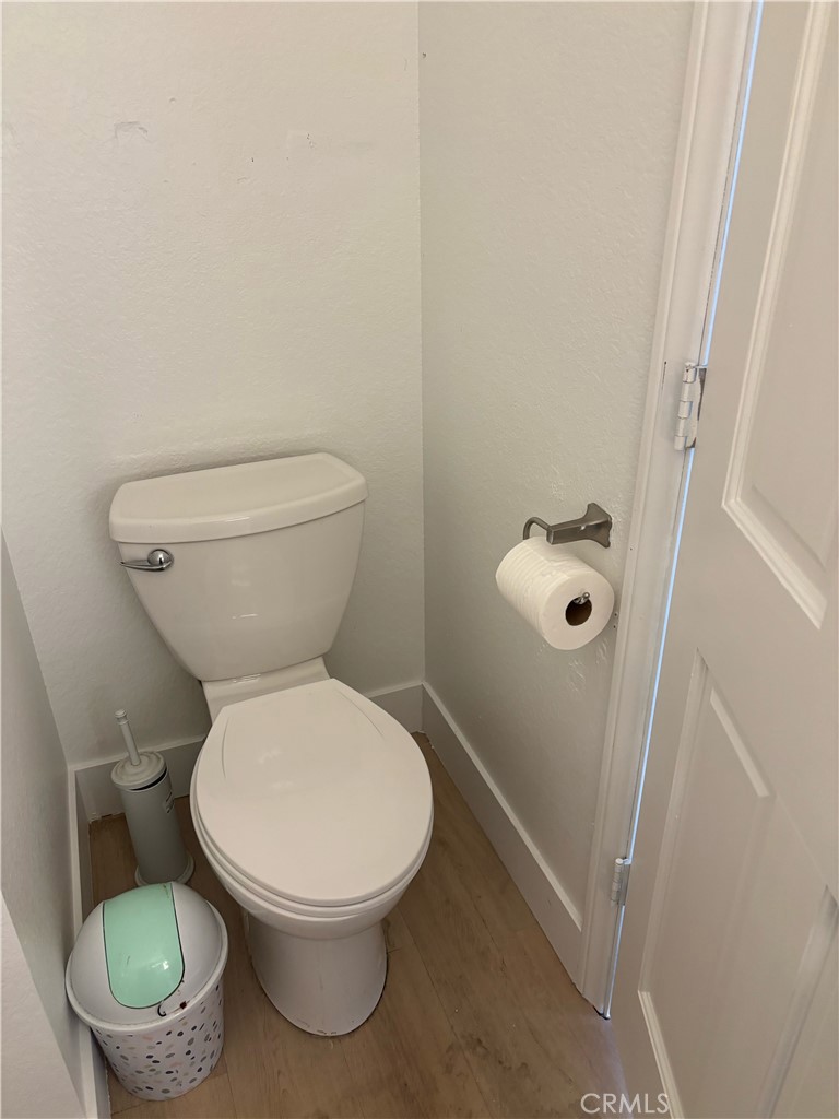 9591 Colfax Road Phelan, CA 92371 - Photo 3 of 24 a white toilet sitting next to a shower