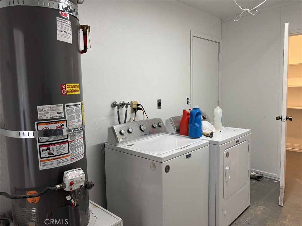 9591 Colfax Road Phelan, CA 92371 - Photo 5 of 24 a utility room with dryer washer and stair