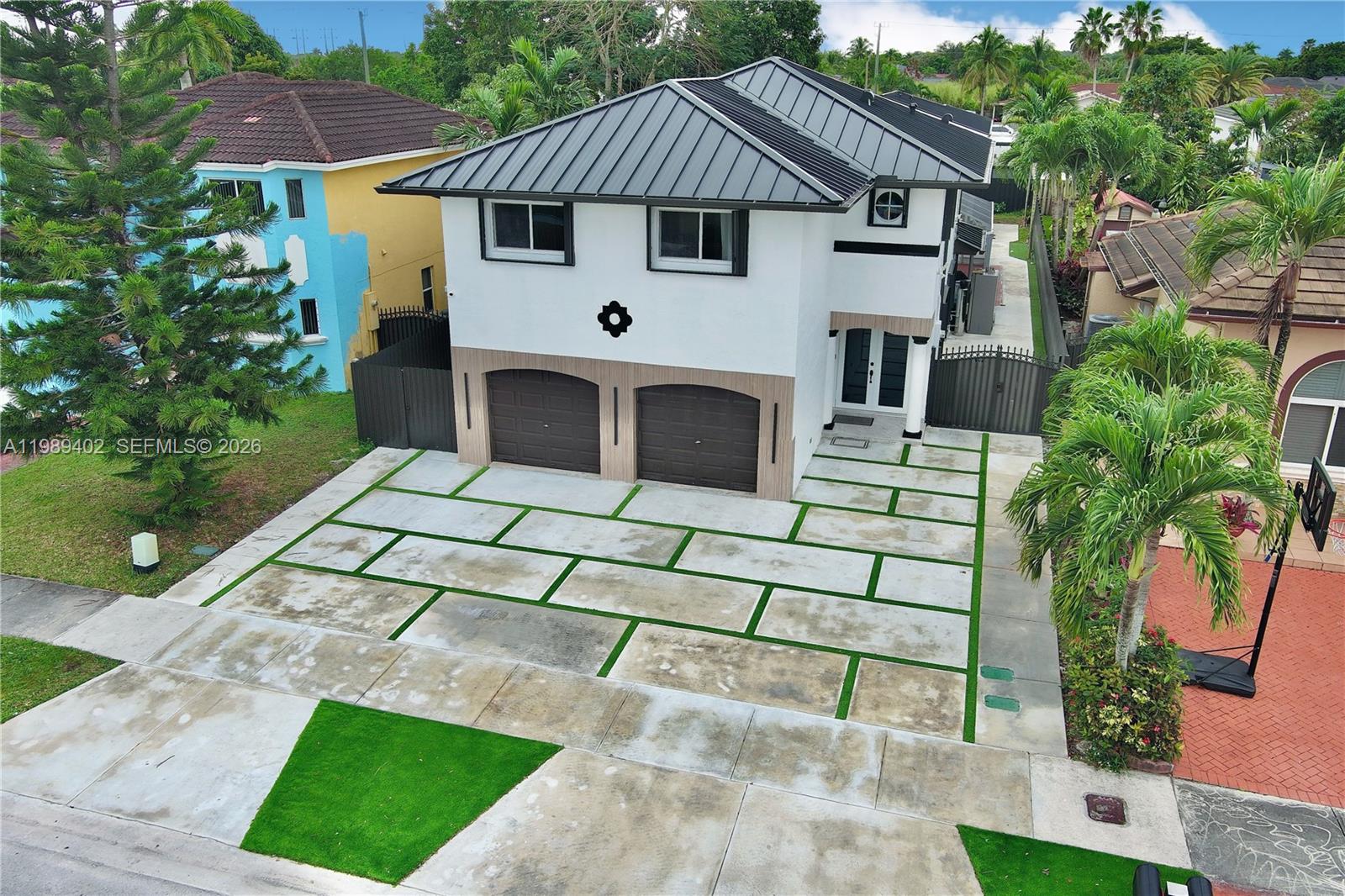 14052 Southwest 167th Terrace Miami, FL 33177 - Photo 1 of 33 a front view of a house with a yard