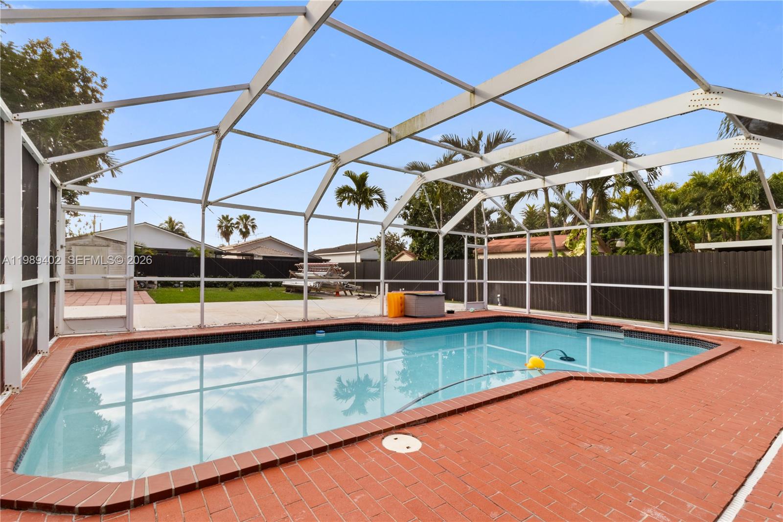 14052 Southwest 167th Terrace Miami, FL 33177 - Photo 13 of 33 a view of a backyard with swimming pool