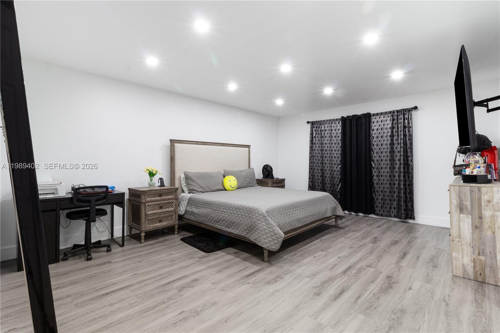 14052 Southwest 167th Terrace Miami, FL 33177 - Photo 17 of 33 a bedroom with a bed and a desk