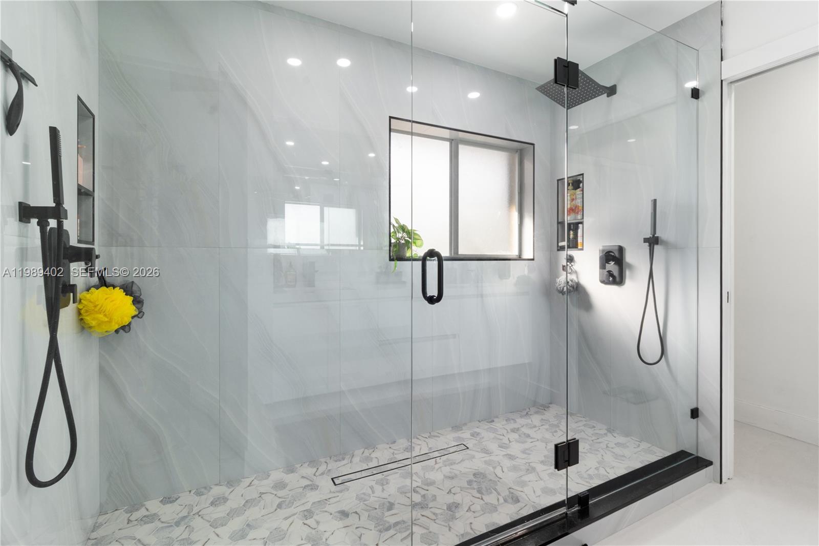 14052 Southwest 167th Terrace Miami, FL 33177 - Photo 19 of 33 a bathroom with a shower