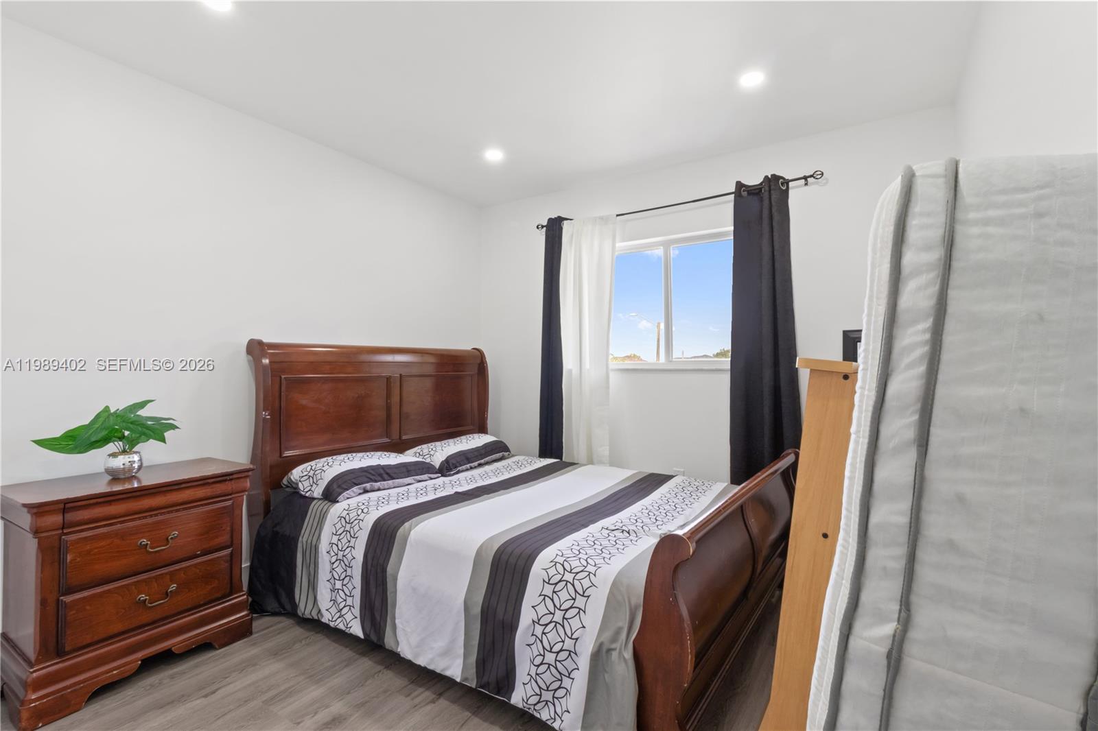14052 Southwest 167th Terrace Miami, FL 33177 - Photo 22 of 33 a bedroom with bed and a window