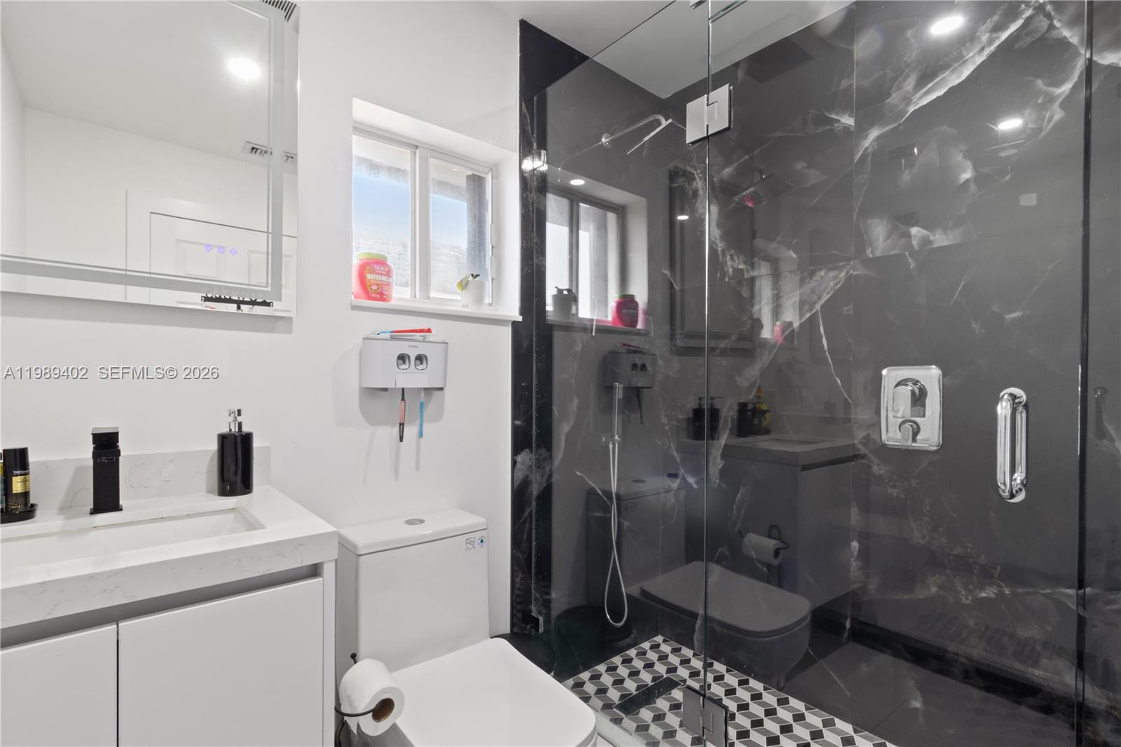 14052 Southwest 167th Terrace Miami, FL 33177 - Photo 24 of 33 a bathroom with a sink toilet and shower