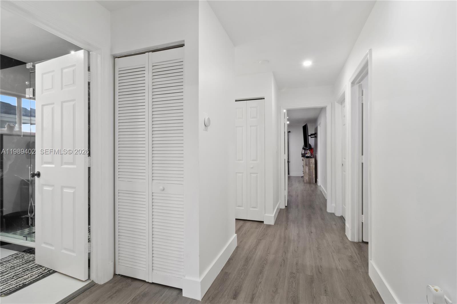 14052 Southwest 167th Terrace Miami, FL 33177 - Photo 25 of 33 a view of a hallway with wooden floor