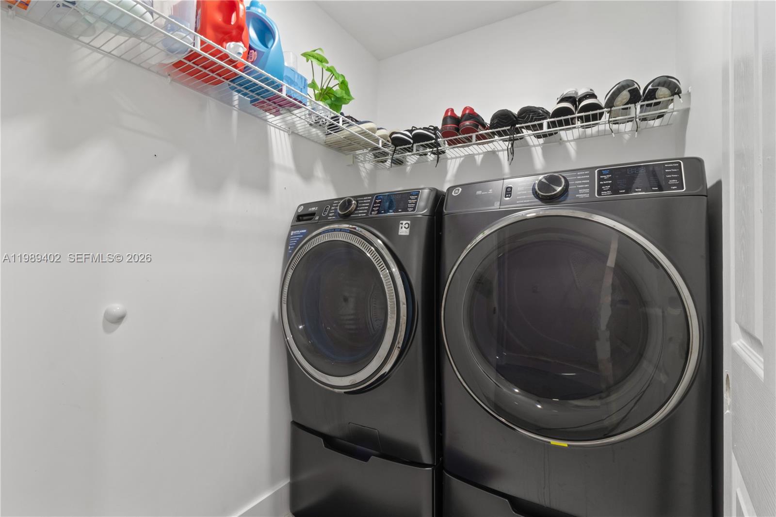 14052 Southwest 167th Terrace Miami, FL 33177 - Photo 26 of 33 a utility room with dryer and washer