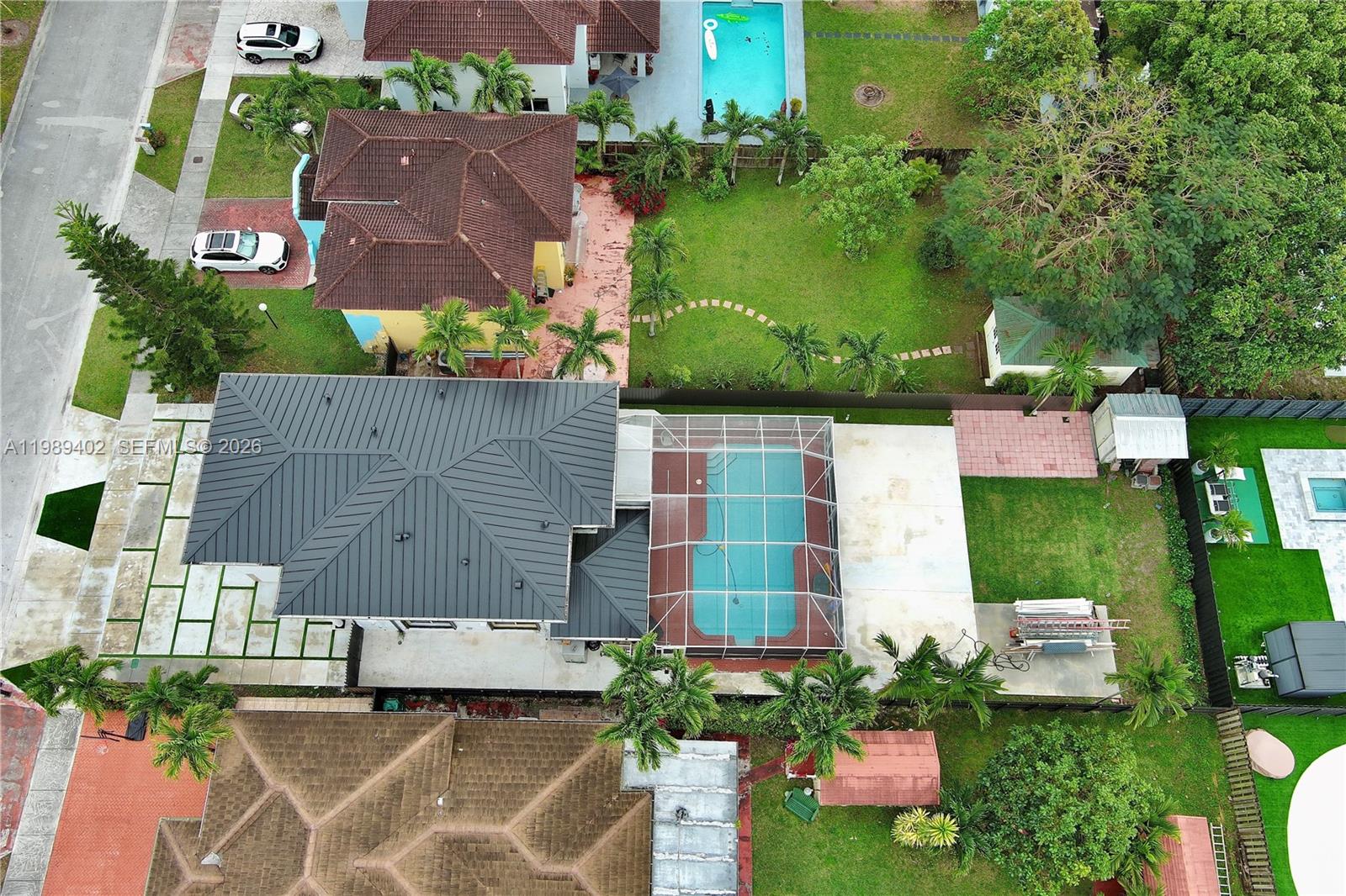 14052 Southwest 167th Terrace Miami, FL 33177 - Photo 33 of 33 an aerial view of multiple houses with yard
