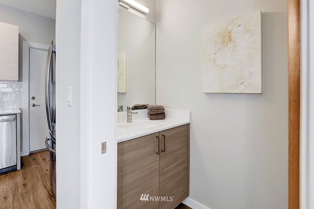 515 Northwest 70th Street Seattle, WA 98117 - Photo 12 of 32 a bathroom with a sink and a mirror
