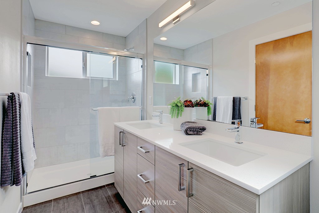 515 Northwest 70th Street Seattle, WA 98117 - Photo 19 of 32 a bathroom with a sink and a mirror