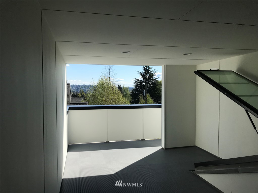 515 Northwest 70th Street Seattle, WA 98117 - Photo 26 of 32 a view of an empty room with a window