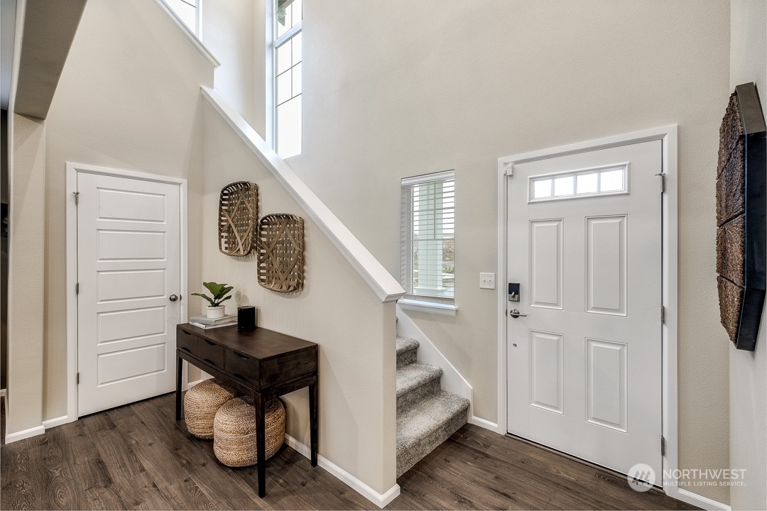 1606 12th Place, Unit 1161 Sultan, WA 98294 - Photo 2 of 20 a view of entryway with wooden floor and stairs