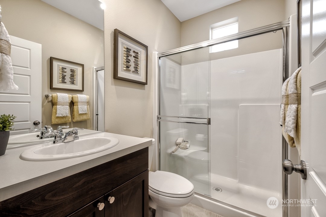 1606 12th Place, Unit 1161 Sultan, WA 98294 - Photo 3 of 20 a bathroom with a sink toilet and shower