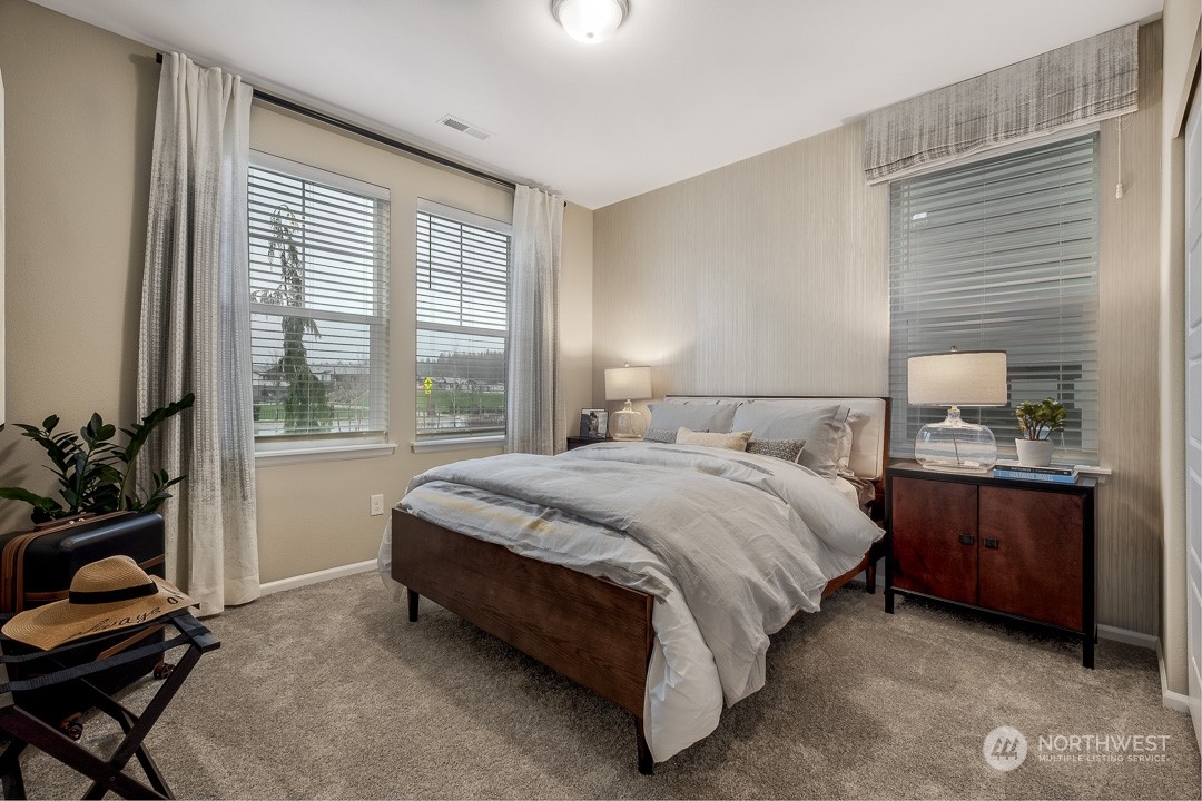1606 12th Place, Unit 1161 Sultan, WA 98294 - Photo 4 of 20 a spacious bedroom with a bed and a window