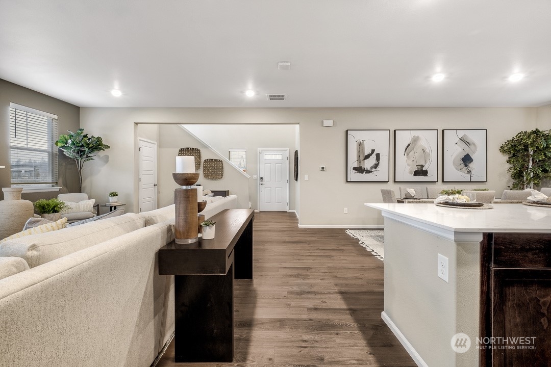 1606 12th Place, Unit 1161 Sultan, WA 98294 - Photo 6 of 20 a living room with furniture and a view of kitchen